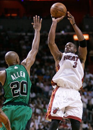 Miami Heat's Dwyane Wade shoots as Boston Celtics' Ray Allen defends in the third quarter in Miami Wednesday night.