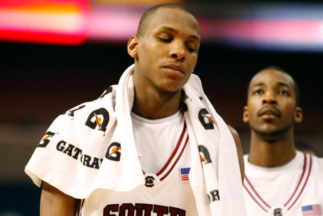 South Carolina's Dominique Archie, left, and Austin Steed leave the court following the Gamecocks' 82-68 loss to Mississippi State in the SEC tournament on Friday in Tampa, Fla.