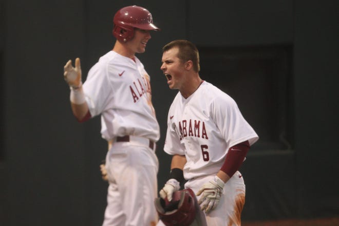 Brandon May, a native of Marietta, Ga., celebrates his first-inning grand slam with after giving the Tide an early 4-0 lead.
