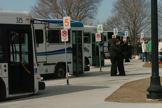 MAX buses park in the bus depot as they wait to pick up passengers