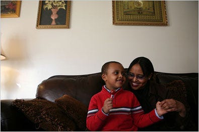 Idil Abdull, with her autistic son, Abdulahi, said some children were sent back to Somalia in hopes of easing their autism.