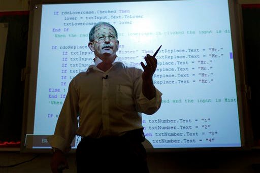 Peter Vos, 50, who once ran an Internet start-up, teaches 8th grade computer programming at Argyle Middle School in Silver Spring, Md., Tuesday, Feb. 24, 2009. Plenty of people dream of leaving their jobs to become teachers; these days more people are actually doing it.