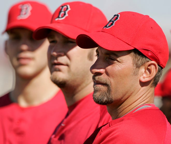 New Red Sox pitchers Brad Penny, center, and John Smoltz, right, battled injuries last season.
