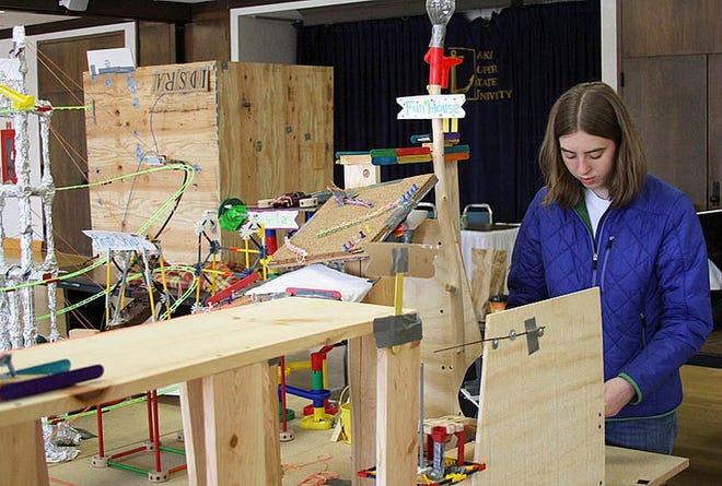 Chelsea Nayback, age 16, from Petoskey High School participated in the Rube Goldberg competition at Lake Superior State University on Tuesday as part of her honor’s physics class. The goal for this year’s participants was to use 20 steps to accomplish one task of replacing a regular light bulb with an energy efficient bulb. The annual competition is held at the university as part of National Engineers’ Week.
