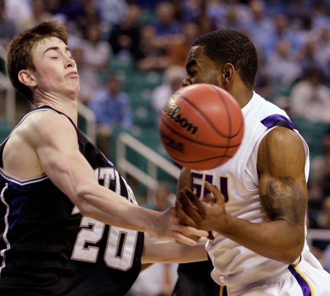 Butler's Gordon Hayward (20) and LSU's Marcus Thornton battle during the first half of an NCAA tournament game in Greensboro, N.C., on Thursday.