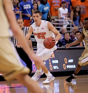 Florida's Chandler Parsons drives down court during the first half of round 1 of the National Invitational Tournament on Wednesday.