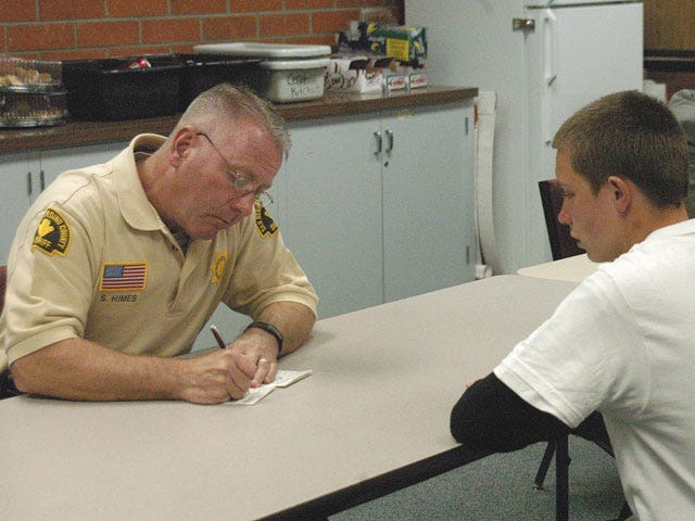 Deputy Sheriff Sheldon Himes of the San Bernardino Sheriff's Department wrote a Barstow district student a citation during a truancy sweep Thursday.