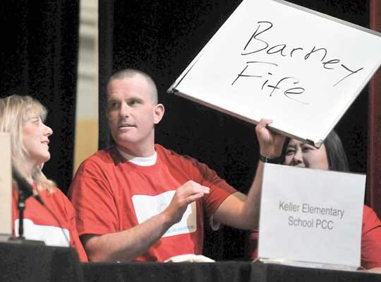 The team of Mary Elias, Herb Grace and Arlene Crandall (right) were eliminated when they incorrectly guessed "Barney Fife" during the Franklin Education Foundation Trivia Bee, Thursday in Franklin. The answer was "Otis" from the Andy Griffith Show.