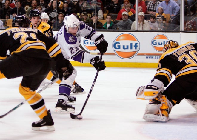 The Kings' Dustin Brown skates in for the winning goal in overtime Thursday night against the Bruins.