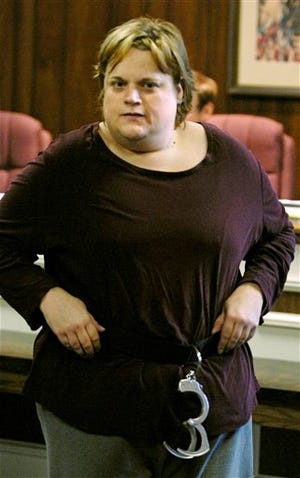 Chris Mason walks back to her seat after pleading not guilty to a charge of reckless homicide in the death of her husband, James Mason, Tuesday Oct. 18, 2008 in Chardon, Ohio. Mason eventually pleaded guilty to reckless homicide in the death of James Mason. Chris Mason will be sentenced Friday.