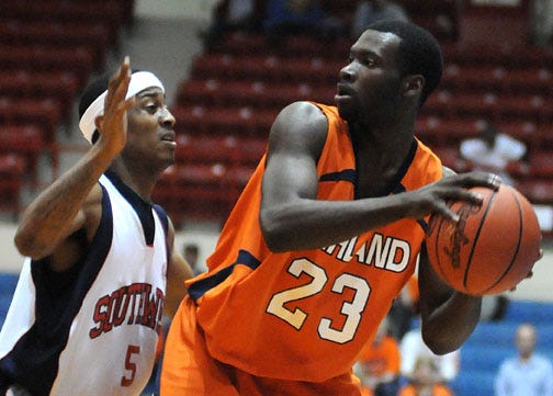 Highland's Tim Steed looks to pass against Southwest Tennessee's Myron Strong Saturday at Hutchinson Sports Arena.