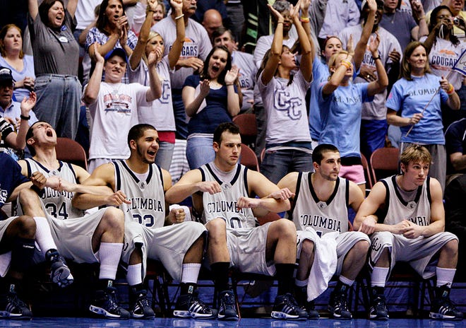 Columbia College’s Vitaly Ahmedov, Taylor Evans, Quintin Totta, Miroslav Lukic and Joe Flanner watch the final moments of Monday night’s 60-56 victory over MidAmerica Nazarene in an NAIA National Tournament semifinal at Municipal Auditorium in Kansas City.