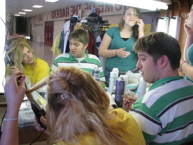 East Peoria Community High School students do their hair and makeup for the opening night of their play, 'Just Another High School Play.' Students from left after senior Christina Shaw, sophomore Cody Pullium and junior Chelsey Young.