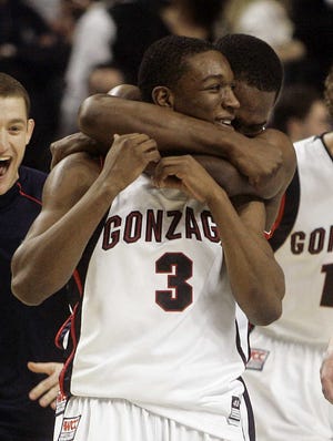 Gonzaga guard Demetri Goodson (3) gets a hug from teammate Jeremy Pargo after sinking the winning shot against Western Kentucky in the second round.