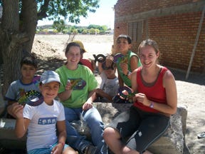 Amanda Bozovsky, left, and Becky Bastian, right, spend time coloring with Argentinian children.
Amanda Bozovsky, left, and Becky Bastian, right, spend time coloring with Argentinian children.
