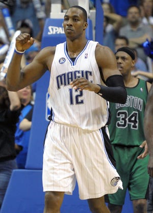 Magic center Dwight Howard celebrates after blocking a shot by Paul Pierce in the waning seconds of Orlando's victory on Wednesday night.