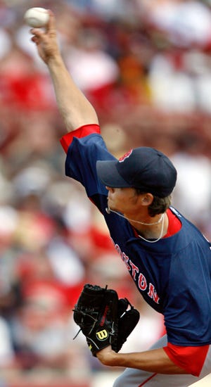Clay Buchholz throws a pitch during his six-inning effort in the Red Sox' 2-1 exhibition win over the Reds on Wednesday in Sarasota, Fla.