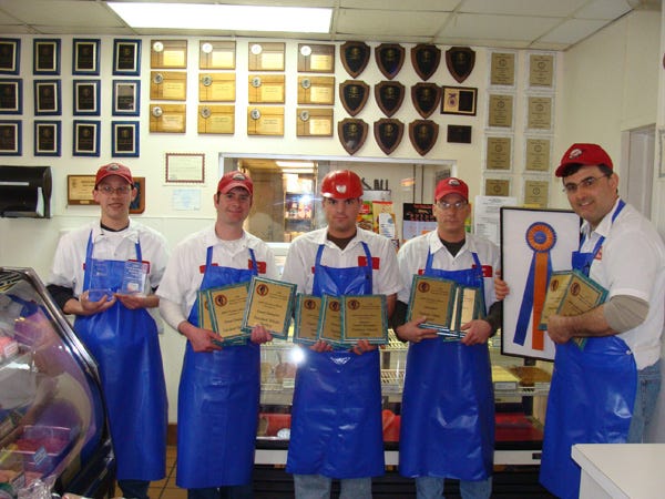 Dan Weber, right, of Weber Meats in Geneseo and several of his employees display some of the awards the company won at the 2009 Illinois Association of Meat Processors contest. Pictured with Weber are, from left: Justin Haser, Matt DeSplinter, Tim Dobbels and Frank Raupp.