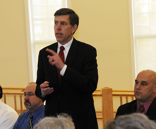 Milford School Committee candidate Mike Walsh speaks at a candidates forum Thursday at the Senior Center.