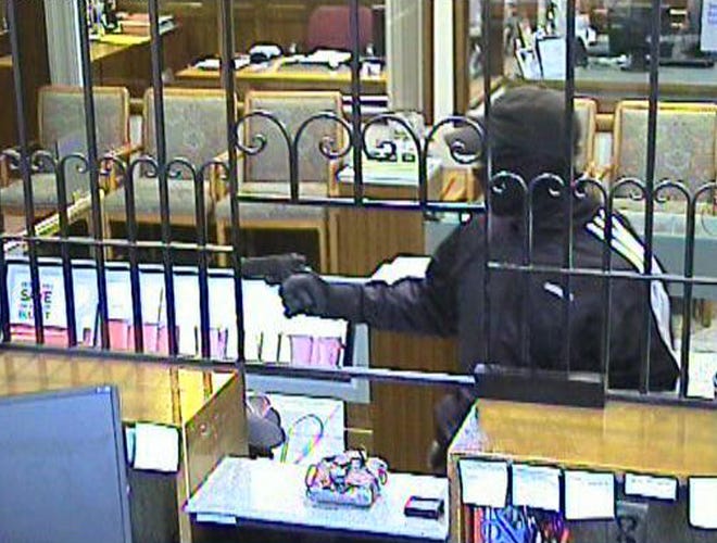 Police released this image from a bank security camera showing an armed man robbing Bank of America on Washington Street in Wellesley.