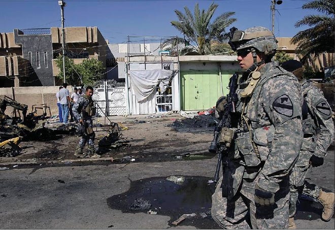 CAR CAR BOMB BOMB:: U U..S S.. and and Iraqi Iraqi soldiers soldiers secure secure the the area area of of a a car car bomb bomb attack attack in in northern northern Baghdad Baghdad,, Iraq Iraq on on Thursday Thursday.