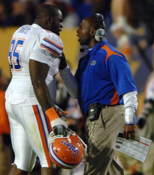 RICK WILSON/The Times-UnionFlorida defensive coordinator Charlie Strong (right) has words for defensive tackle Torrey Davis after Davis received an unsportsmanlike conduct penalty during the fourth quarter of the BCS national championship game against Oklahoma on Jan. 8 at Dolphin Stadium in Miami.