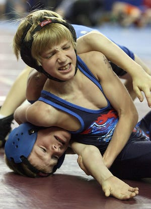 Junior Viking wrestler Daray Podlena, top, battles in Saturday's semifinal match in the 8-under 52-pound class. Podlena finished in sixth place.