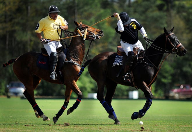 Members of Biddle Realty (left) and Burger King teams battle it out during the final event of the 2009 Aiken Triple Crown -- the Pacers and Polo Triple Crown Polo Match in Aiken.