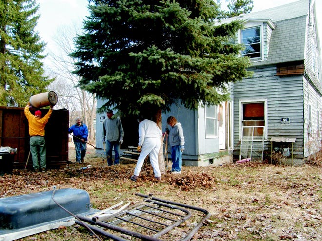 Habitat for Humanity volunteers help clean up the home at 155 N. East St., in Ilion to prepare for the upcoming rehab. Shown from left at the site are Steve Keyser, Frank Kucerak, Orra Cross, Marion Bruins, and Chris Mergenthaler.