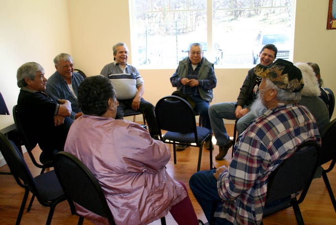 Elders fluent in the Karuk langauge sit in the speakers’ circle on Saturday, enjoying some good laughs while practicing the language of their ancestry.
