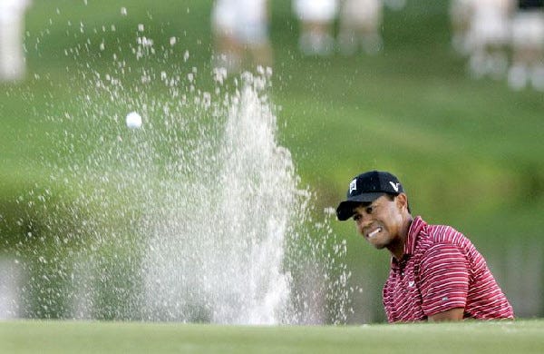 Nothing would keep Tiger Woods from victory Sunday at Bay Hill, not even a buried bunker shot on the 17th hole.