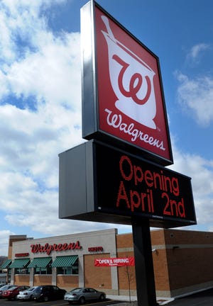The Walgreens sign on South West Avenue lets Freeport know Wednesday that they will be opening April 2.