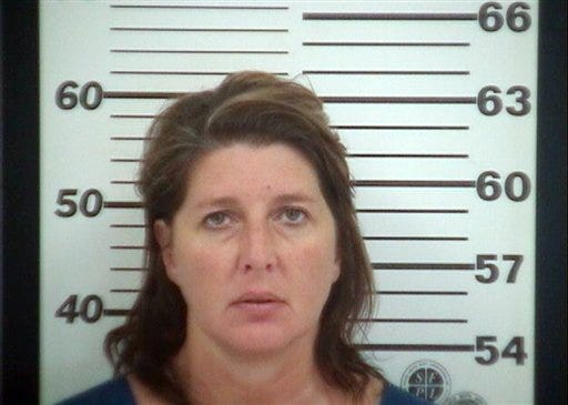 In this photo provided by the Platte County Prosecutor's Office, Karen Christine Downs is shown. The Kansas City mother and Kelsee Guest, 25, are accused of providing alcohol to several girls during a birthday party that ended with two teens being taken to a hospital. (AP Photo/Platte County Prosecutor's Office)