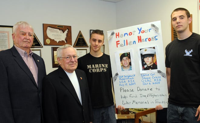Franklin High School students Jamie Clavizio, second from right, and Vince Pellegri, right, raised money for a veterans monument for soldiers from the Iraq and Afghanistan wars. With them are Franklin Veterans Agent Bob Fahey, left, and veteran Bob Gagnon.