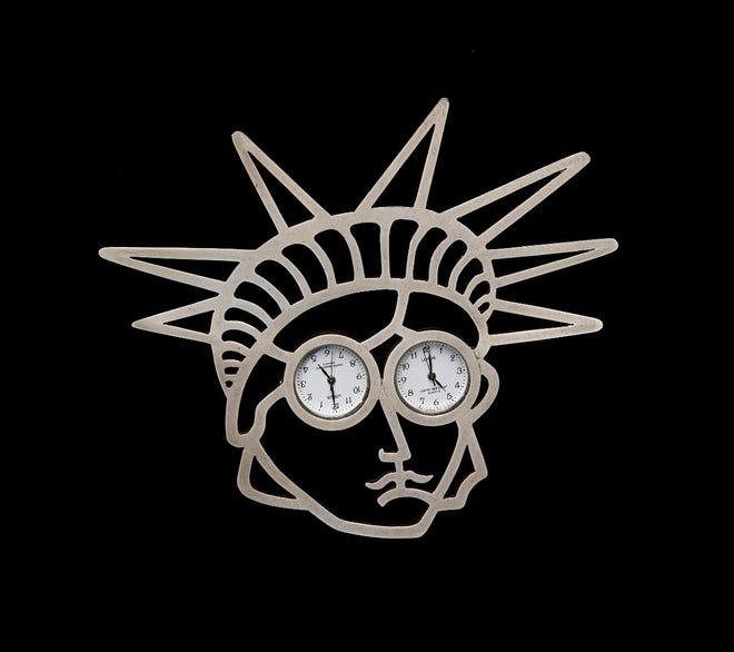 This undated photo provided Courtesy of the Madeleine Albright Collection and the Museum of Arts and Design, shows a brooch owned by the nation's first female secretary of state under President Clinton, Madeleine Albright. It is titled "Liberty, 1997, by Gijs Bakker, Silver 925, watches."