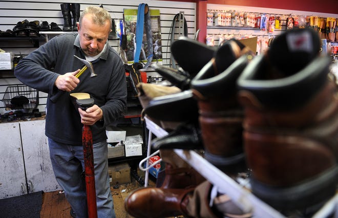 Lenny Schegolev works yesterday in his Natick shop, Odessa Instant Shoe Repair, at the corner of Rte. 9 and Oak Street.
