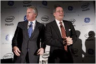 Jeffrey Immelt of General Electric, left, and Paul Otellini of Intel on Thursday in New York, announcing the joint effort, intended to let doctors use a two-way connection to help patients.