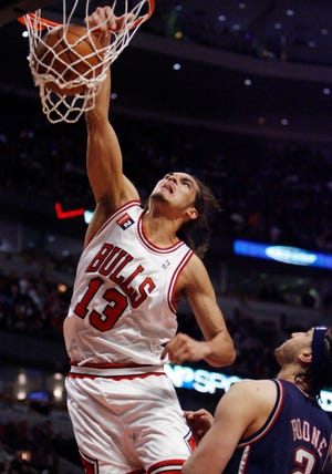 Chicago Bulls' Joakim Noah dunks against the New Jersey Nets during the fourth quarter on April 4, 2009, in Chicago. The Bulls won 103-94.