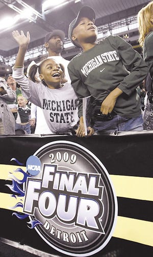 Michigan State fans wave during the team's practice session at the men's Final Four NCAA college basketball tournament Friday, April 3, 2009, in Detroit. Michigan State will face Connecticut in a semifinal game Saturday. (AP Photo/Eric Gay)