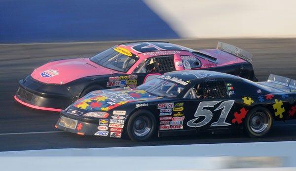 Carlos Vieira (51) and Scott Masellis (92) race in Saturday’s Western Late Model trophy dash.