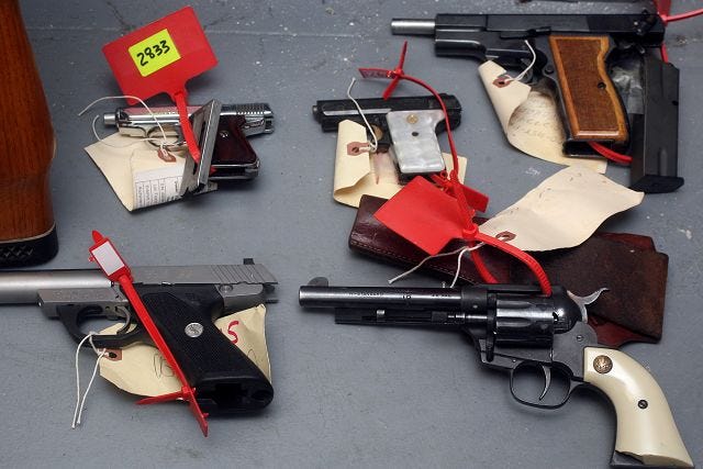 EJ Hersom/Staff photographer
Several confiscated hand guns are displayed at the Rochester Police Department.