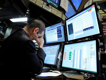 In this March 2, 2009 file photo, specialist Michael Sollitto works on the floor of the New York Stock Exchange. The Dow Jones industrial average plummeted below 7,000 at the opening bell and kept driving lower that day, finishing at 6,673 – a loss of nearly 300 points. The first quarter on Wall Street was so extreme it included a bear market and a bull market all its own – moves that sometimes take years or more. Now investors head for spring still unsure which side is in control.