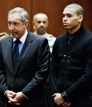 Chris Brown, right, and his attorney Mark Geragos, left, appear during his arraignment on two felony charges, at the Los Angeles County Criminal Courts in downtown Los Angeles on Monday, April 6, 2009. Brown, pleaded not guilty to threatening and assaulting his girlfriend, fellow music superstar Rihanna.