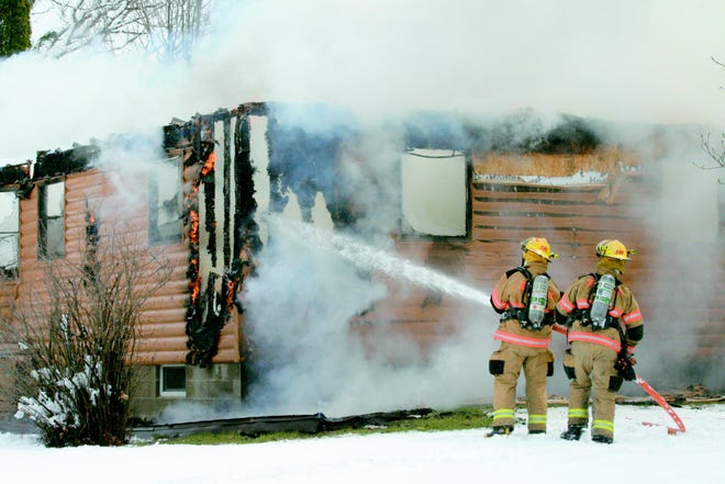 Jonesville firefighters battle a fire Monday, April 6, 2009 on Ball Road.