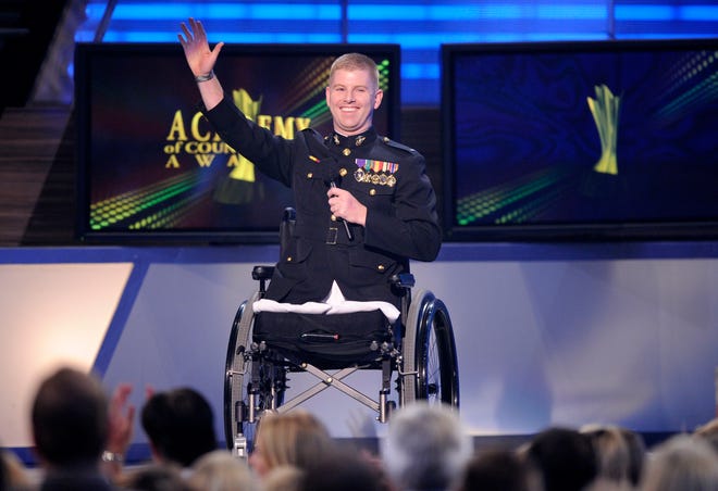 Marine 1st Lt. Andrew Kinard of Spartanburg introduces the performance by Trace Adkins at the 44th Annual Academy of Country Music Awards in Las Vegas on Sunday. Kinard will attend law school this fall at Harvard.