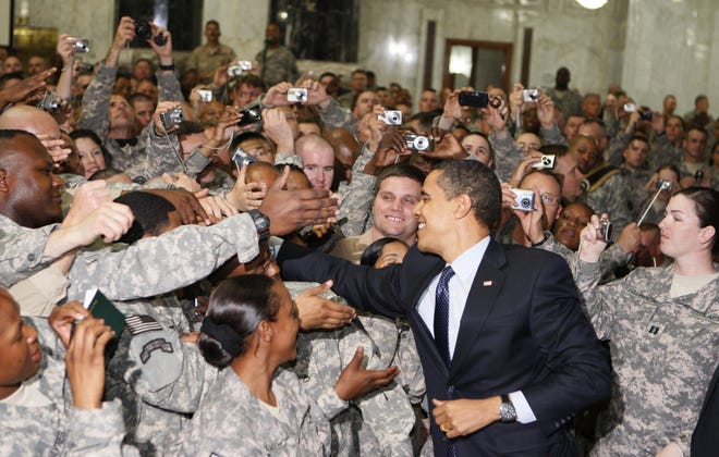 President Barack Obama greets military personnel Tuesday, April 7, 2009, at Camp Victory in Baghdad, Iraq.