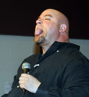 Motivational speaker Jeff Yalden sticks his tongue out as he speaks to students at Remington Middle School in Franklin on Wednesday.