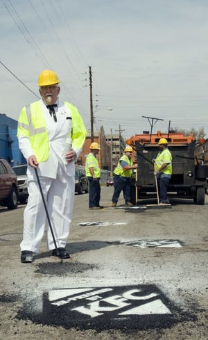Potholes filled in as part of the KFC program are to be branded by a large stencil in non-permanent street chalk saying, "Re-Freshed by KFC."