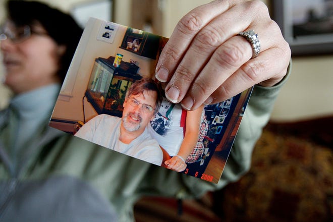 Andrea Phillips holds a photo of her husband, Capt. Richard Phillips, on Wednesday at her home in Underhill, Vt. Phillips is the captain of the U.S.-flagged cargo ship Maersk Alabama which was hijacked Wednesday by Somali pirates off the Horn of Africa.