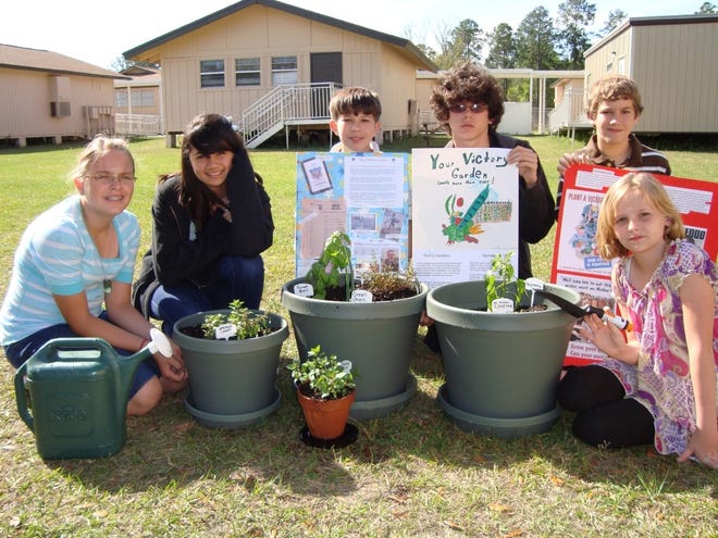 SUZANNE RIMMER/SpecialSixth-graders at Swimming Pen Creek Elementary School recently completed projects on the victory gardens of World War II and even planted their own. Students include Stephanie Welch (from left), Kayla Chaffin, Zack King, Kenneth Miller, Jordan Segui and Chelsea Justice.